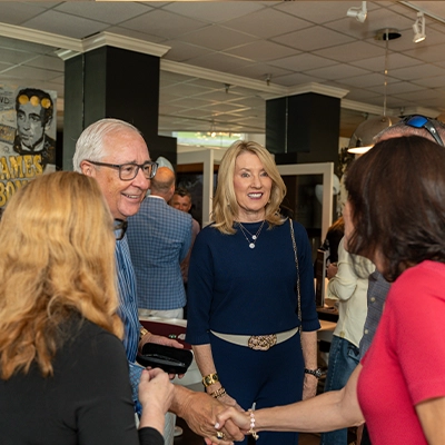 Guests greet and mingle during the Naples Auto Vault and Clive Daniel event