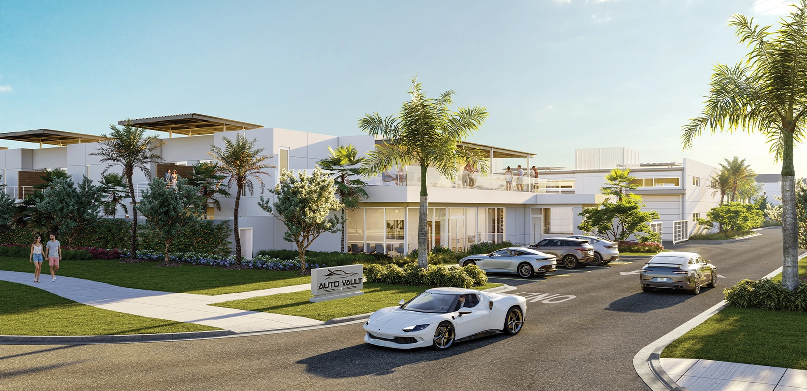 Entrance to luxury auto storage facility with palm trees and sports cars on driveway